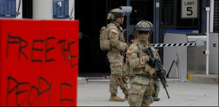  of the California National Guard stand outside the Edward R. Roybal federal building after their deployment by U.S. President Donald Trump, in response to protests against immigration sweeps, in Los Angeles, California, U.S. June 8, 2025. REUTERS/Mike Blake